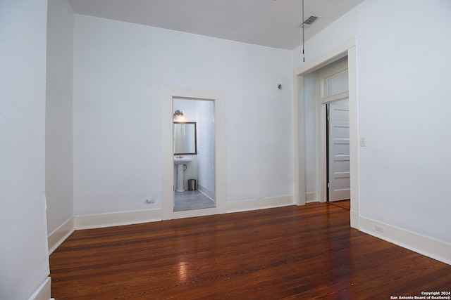 spare room with hardwood / wood-style floors