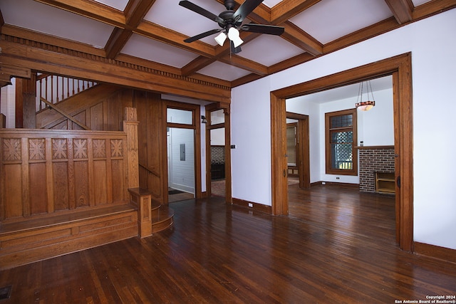 unfurnished room with dark wood-type flooring, coffered ceiling, beam ceiling, and ceiling fan