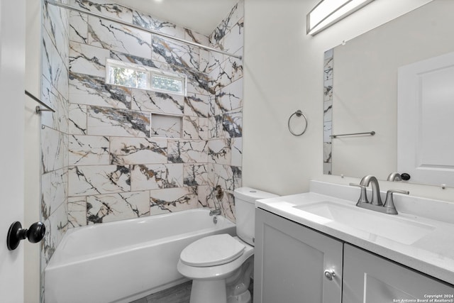 full bathroom featuring vanity, toilet, and tiled shower / bath