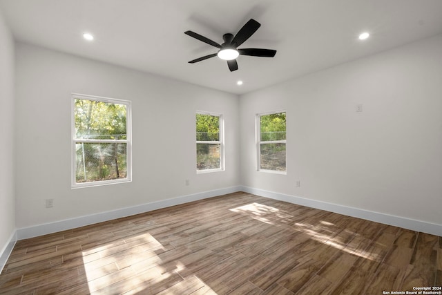 unfurnished room with ceiling fan and wood-type flooring