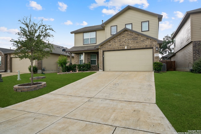 front facade featuring a front yard and a garage