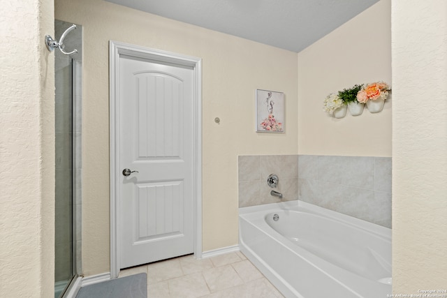 bathroom with tile patterned floors and plus walk in shower