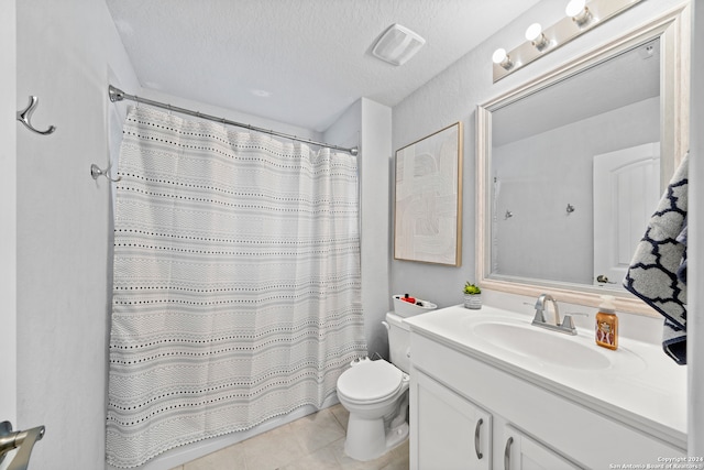 bathroom with vanity, toilet, a shower with curtain, and a textured ceiling