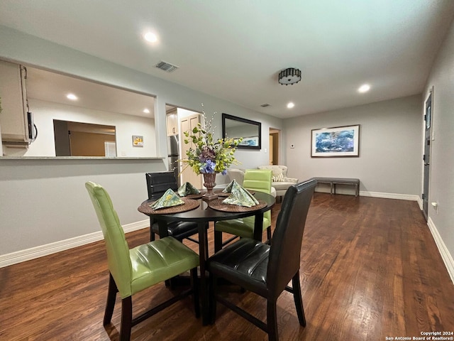 dining room featuring dark wood-type flooring