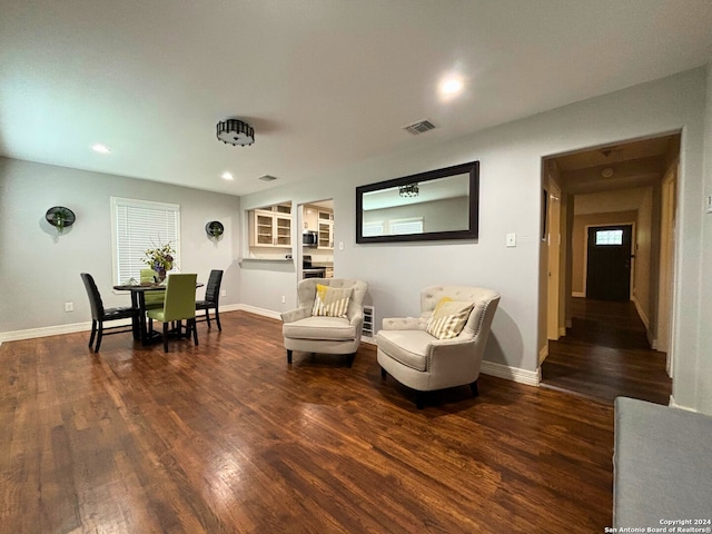 living room with dark hardwood / wood-style flooring