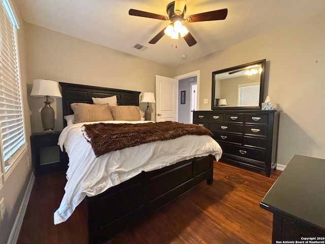 bedroom featuring ceiling fan and dark hardwood / wood-style flooring