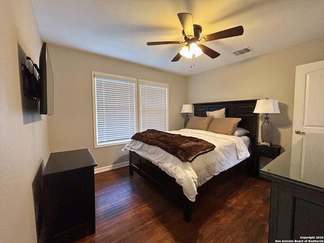 bedroom featuring ceiling fan and dark hardwood / wood-style floors