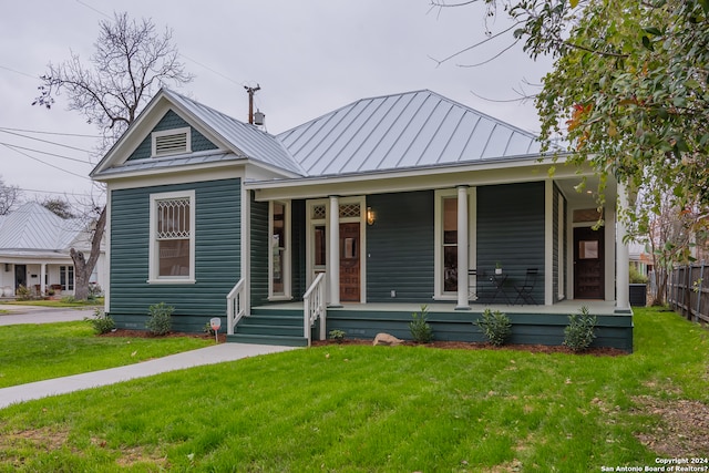 view of front of house with a front lawn and a porch