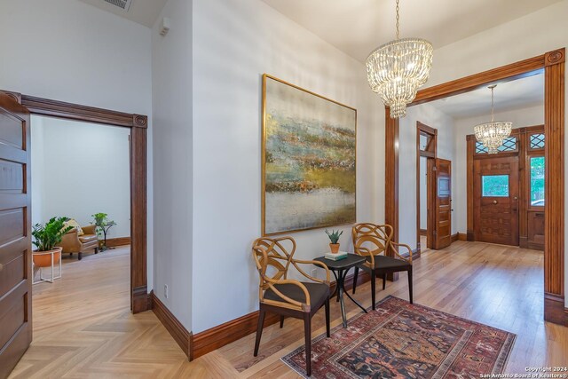 entryway featuring an inviting chandelier