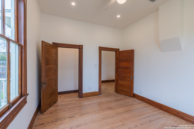 unfurnished bedroom with light hardwood / wood-style flooring and ceiling fan