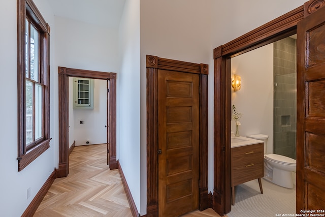 hall with plenty of natural light and light parquet flooring