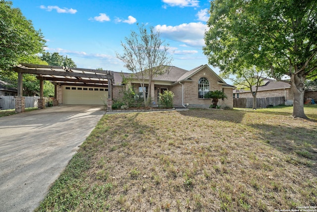 ranch-style house featuring a front lawn and a garage