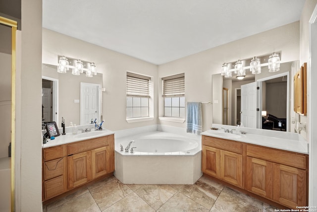 bathroom featuring vanity, a bathtub, and tile patterned floors