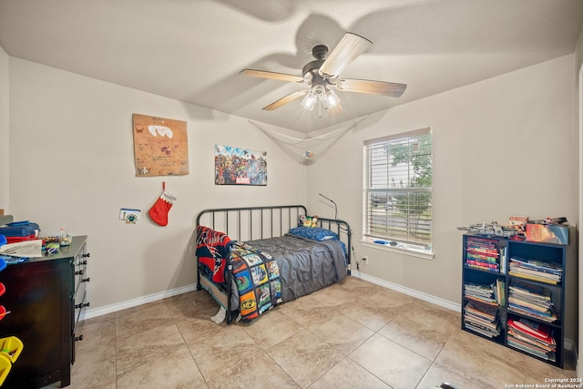 tiled bedroom with ceiling fan