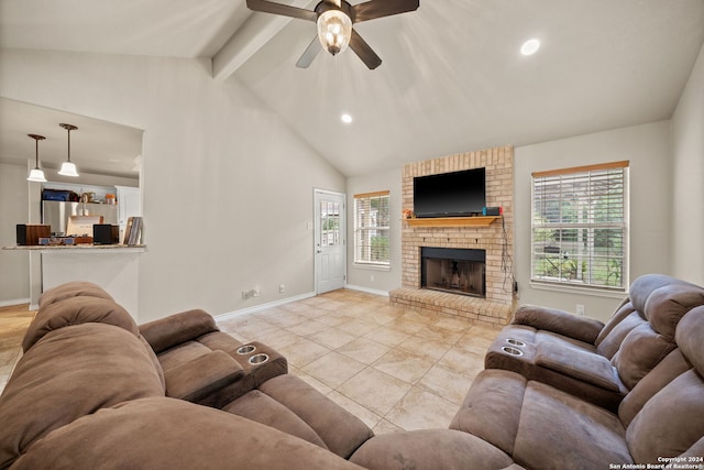 living room with ceiling fan, light tile patterned floors, plenty of natural light, and a brick fireplace