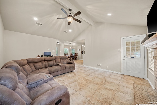 living room featuring ceiling fan, light tile patterned floors, and lofted ceiling with beams