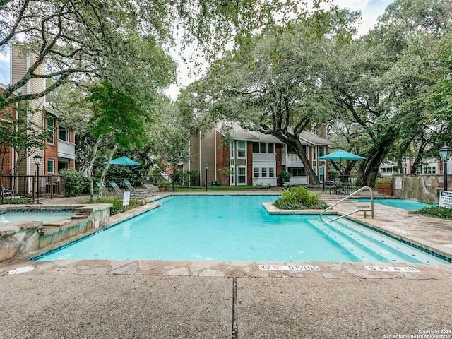 view of pool featuring a patio