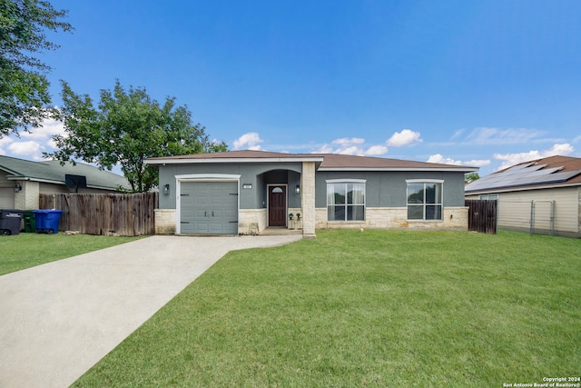 view of front of property featuring a garage and a front yard