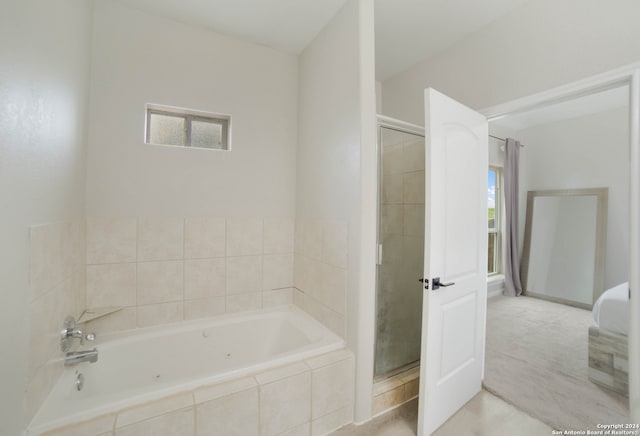 bathroom with separate shower and tub