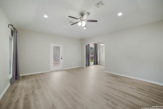 spare room with light hardwood / wood-style flooring and ceiling fan