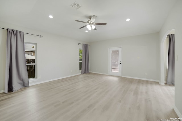 empty room featuring ceiling fan and light hardwood / wood-style floors