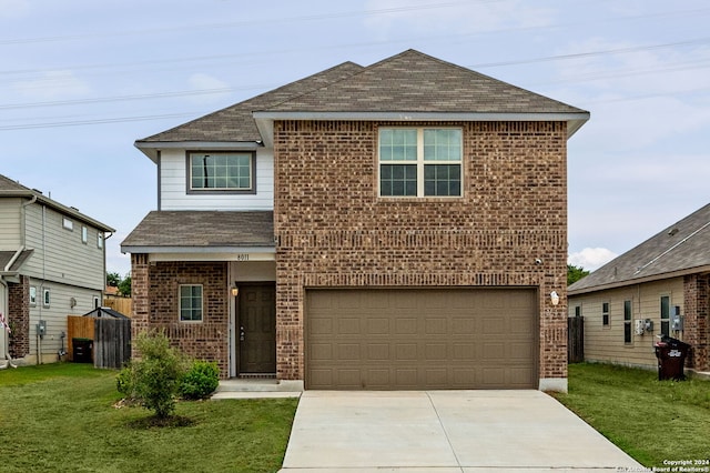 front of property with a garage and a front yard