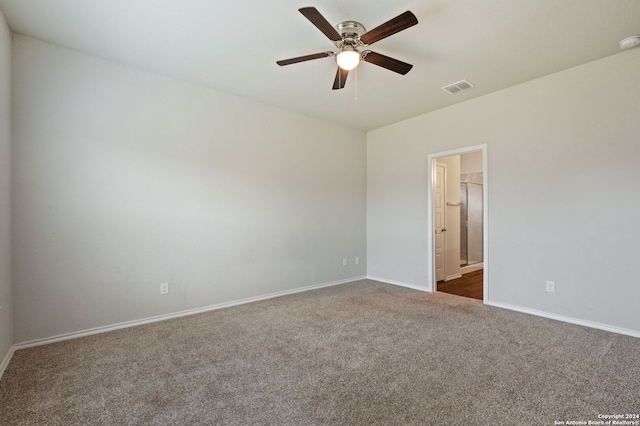 carpeted empty room featuring ceiling fan