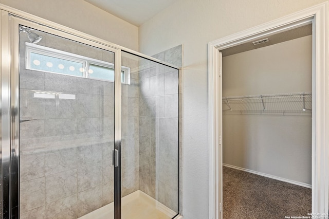 bathroom featuring an enclosed shower