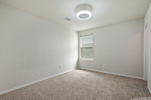 unfurnished room with carpet floors