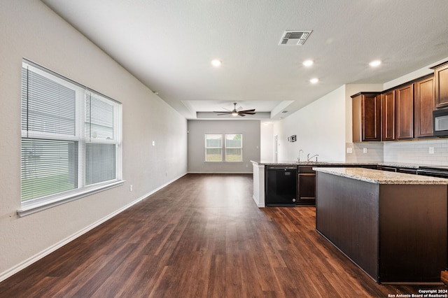 kitchen featuring a wealth of natural light, black appliances, ceiling fan, and dark wood-type flooring