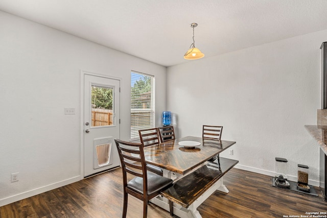 dining space featuring dark hardwood / wood-style flooring