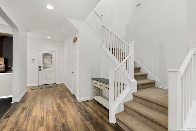 entryway with dark wood-type flooring