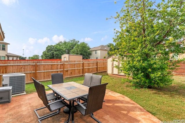 view of patio / terrace featuring a storage shed and central AC