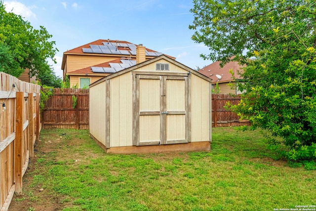 view of outdoor structure featuring a lawn