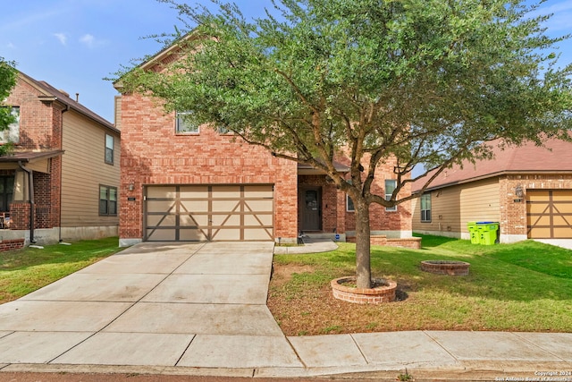 view of front of home with a front yard and a garage