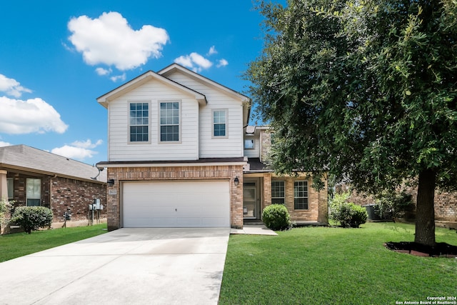 view of front property featuring a garage and a front yard