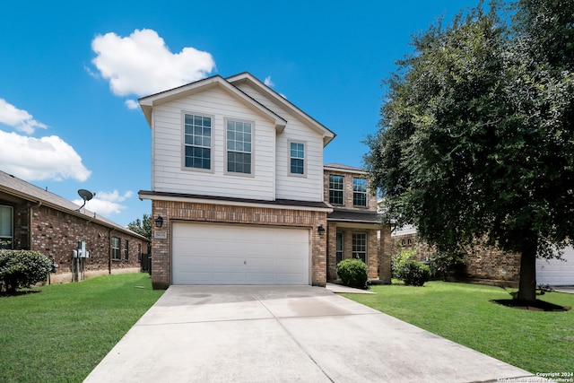 view of property with a garage and a front yard