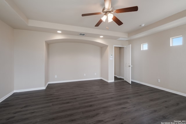 empty room featuring ceiling fan and dark hardwood / wood-style flooring