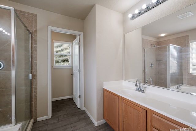 bathroom featuring vanity, hardwood / wood-style flooring, and independent shower and bath