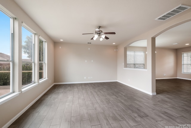 spare room featuring ceiling fan and wood-type flooring