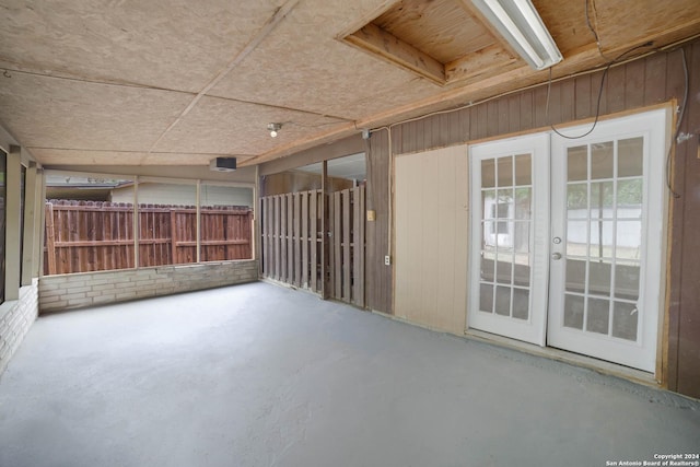 view of patio with french doors and fence