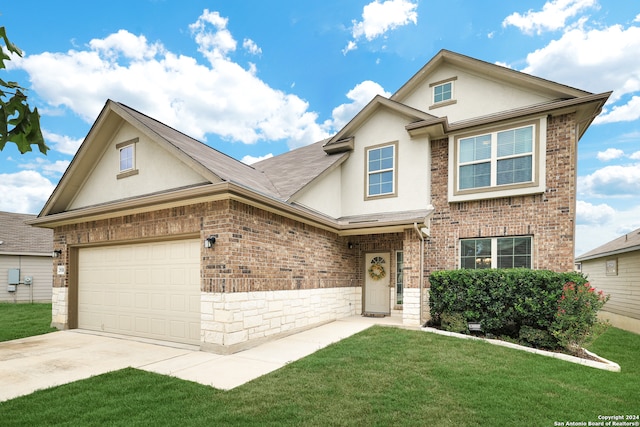 view of front facade featuring a garage and a front lawn