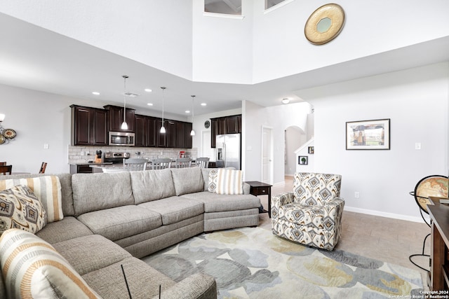 living room with a towering ceiling