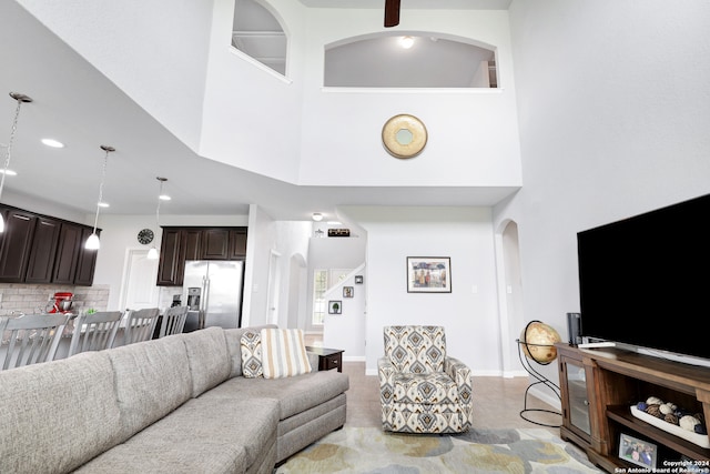 living room featuring a high ceiling