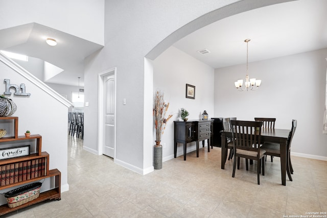 dining area featuring a notable chandelier