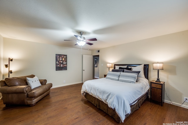 bedroom featuring ceiling fan and dark hardwood / wood-style floors