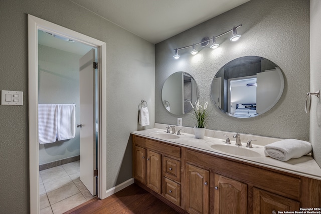 bathroom featuring tile patterned flooring and vanity