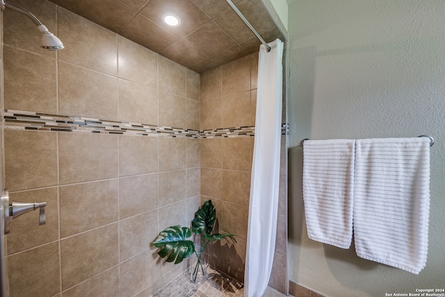 bathroom with a shower with shower curtain