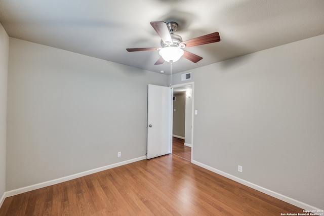 unfurnished room with ceiling fan and light hardwood / wood-style floors