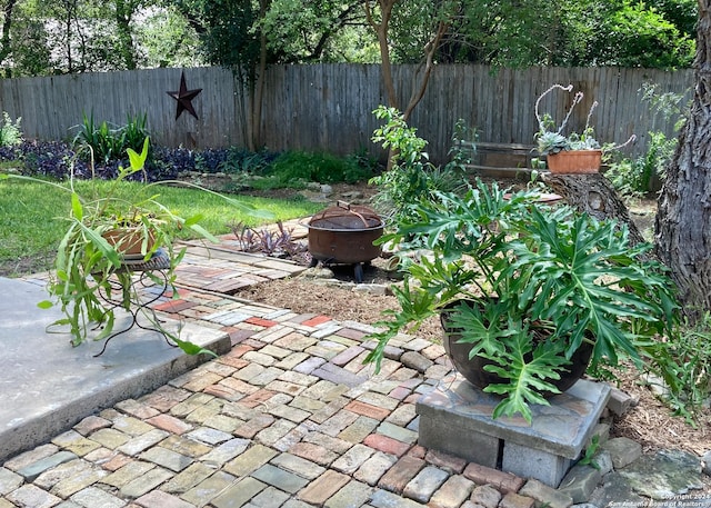 view of patio / terrace with a fire pit